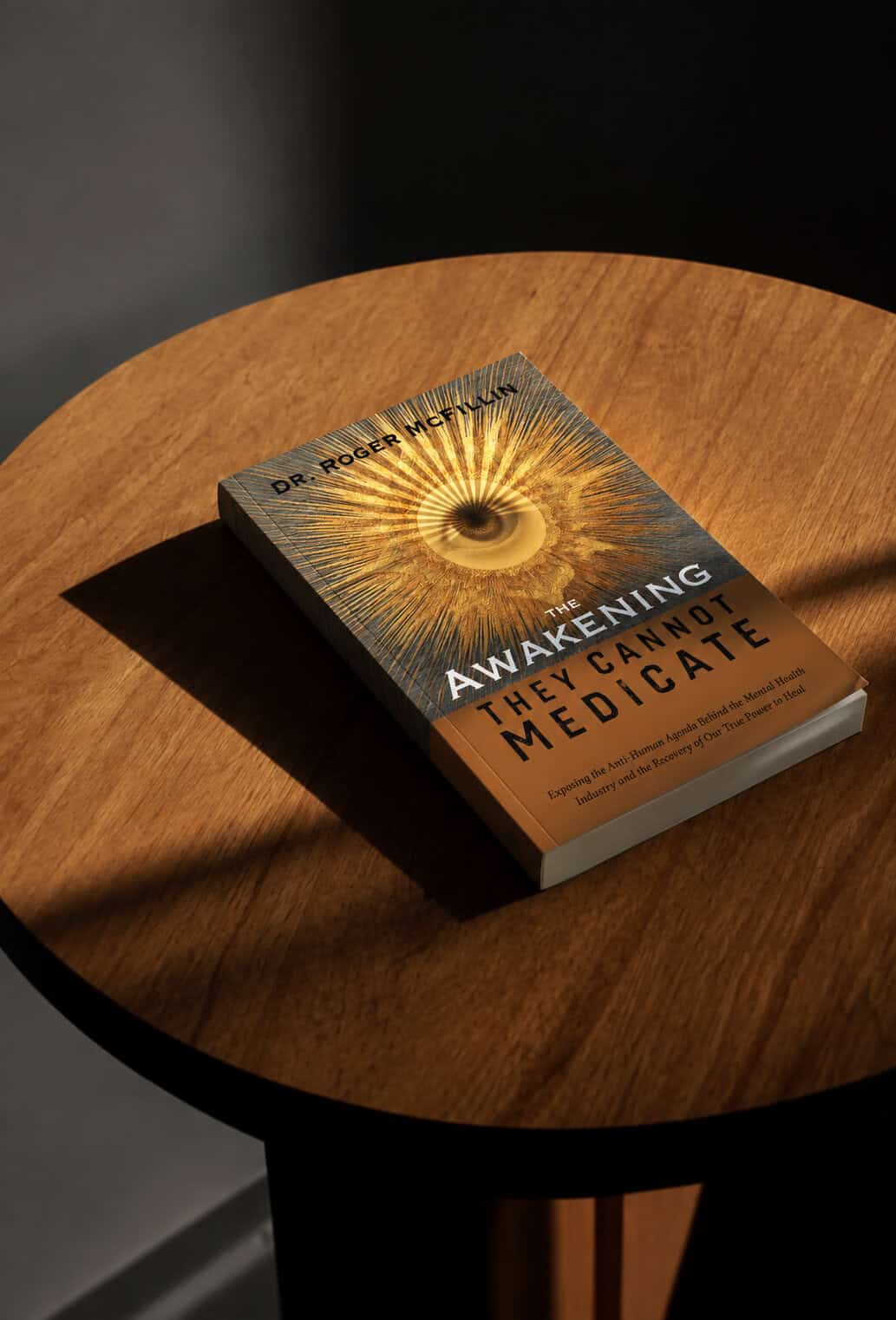 Book titled 'Awakening: The Cannot Medicate' on a wooden table with dramatic lighting.